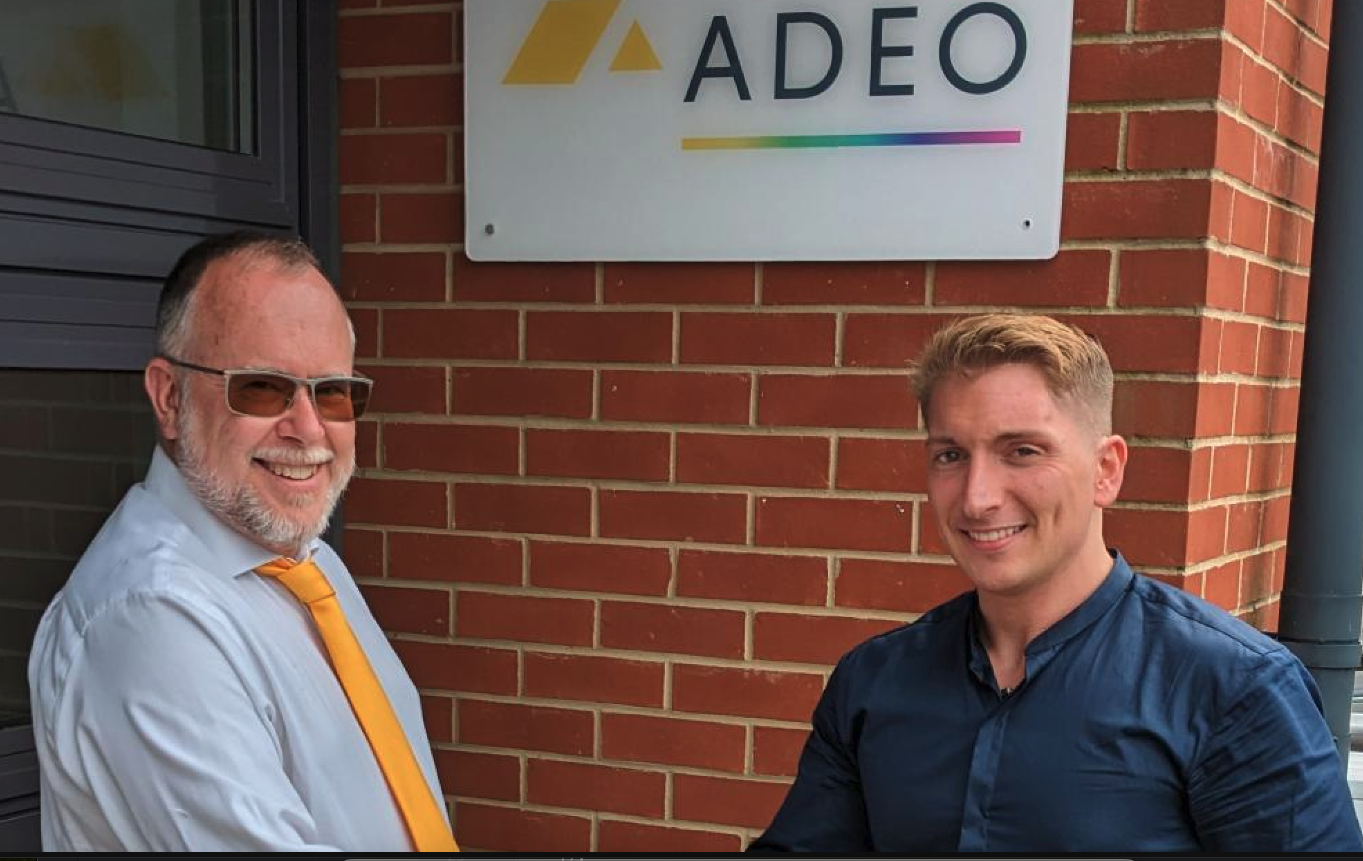 Ian shaking hands with Jody at Adeo head office change