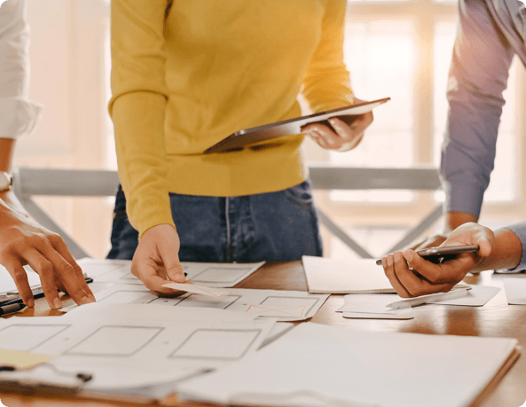 Construction team planning around a table